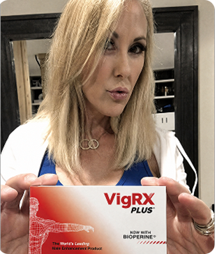 Brandi Love holding VigRX Plus